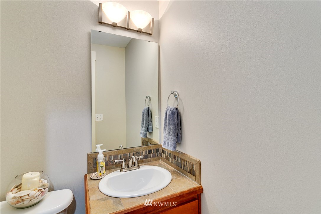 10303 Holman Road North, Unit C Seattle, WA 98177 - Photo 11 of 23 a bathroom with a sink and a mirror