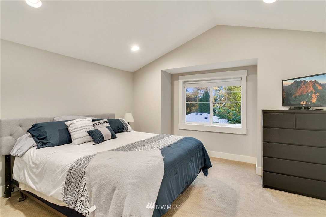 10303 Holman Road North, Unit C Seattle, WA 98177 - Photo 12 of 23 a bedroom with a bed and a window
