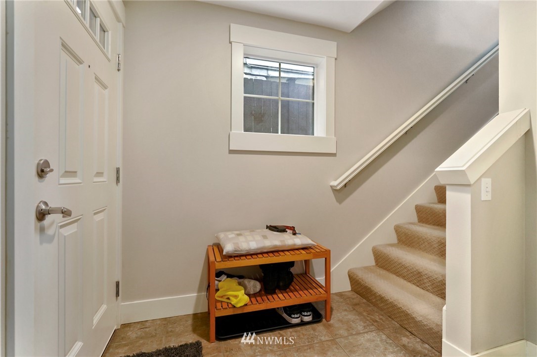 10303 Holman Road North, Unit C Seattle, WA 98177 - Photo 17 of 23 a room that has a couch and a table in it