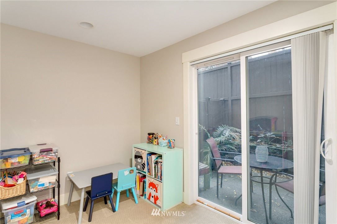 10303 Holman Road North, Unit C Seattle, WA 98177 - Photo 18 of 23 a view of play room with toys and wooden floor