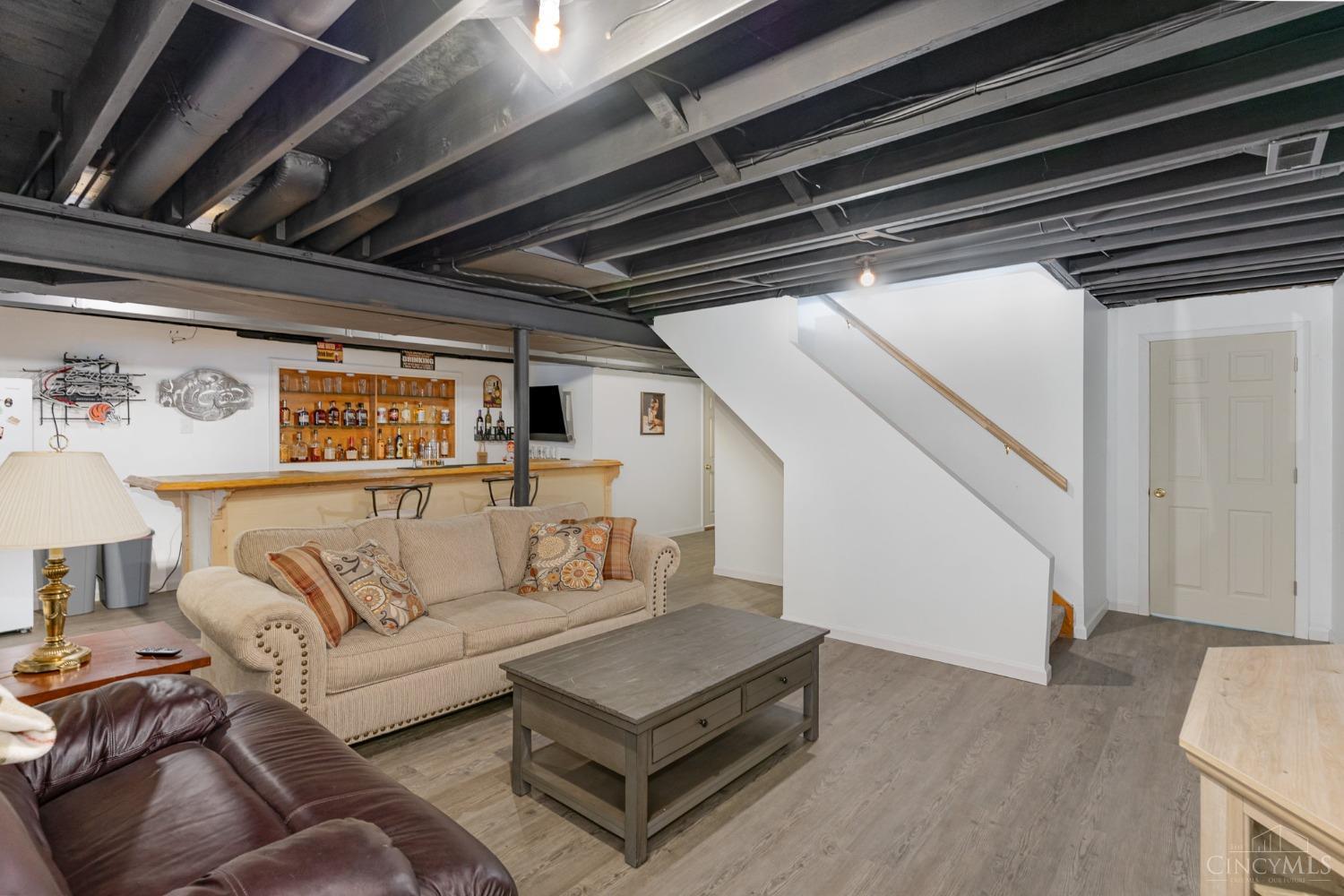 6868 Springdale Road Cincinnati, OH 45247 - Photo 24 of 43 Basement family room with bar.