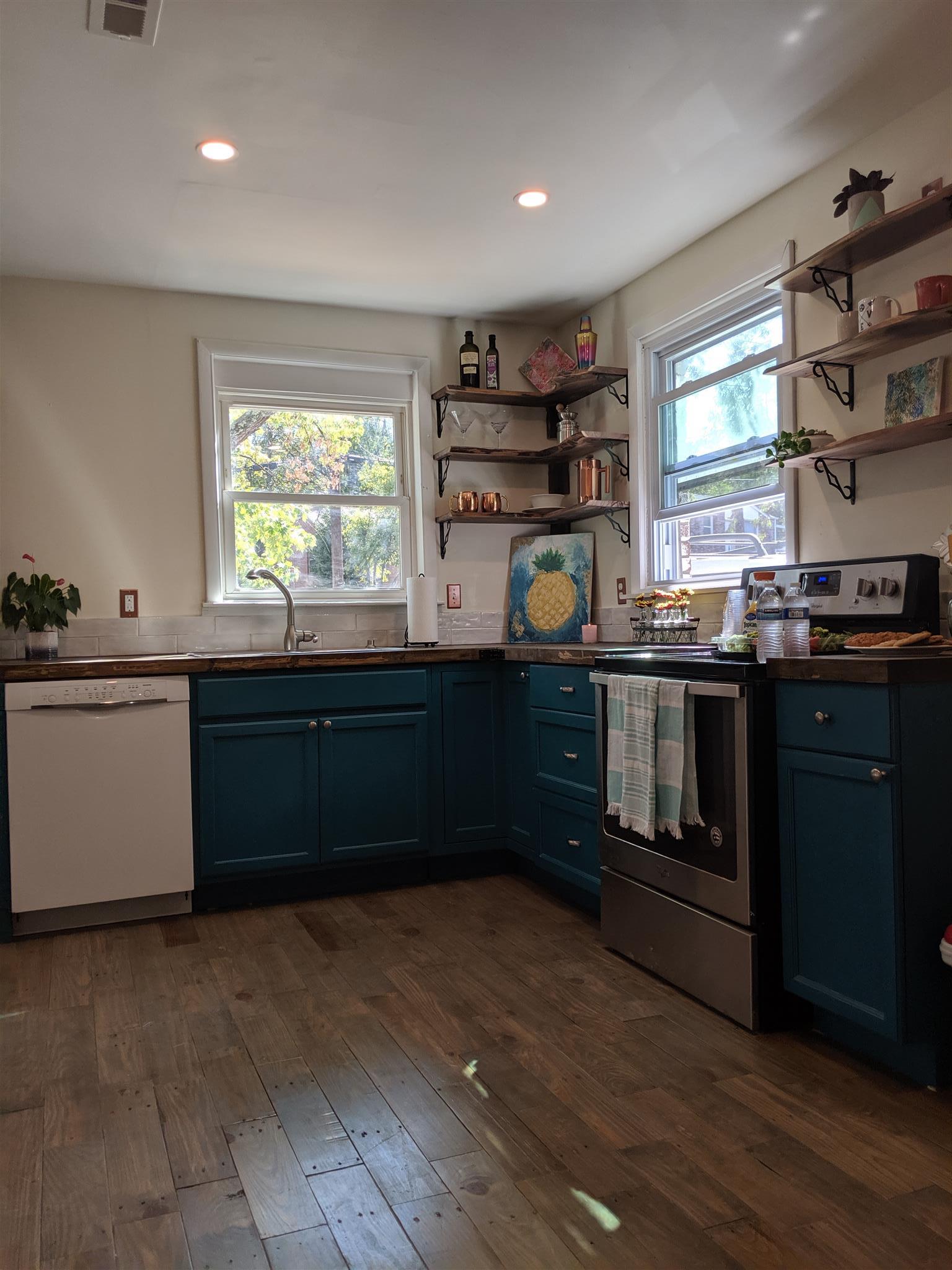 1495 Dolan Road Nashville, TN 37218 - Photo 3 of 20 The kitchen has custom shelves, butcher block counter tops, reclaimed wood floors, and lots of natural light!
