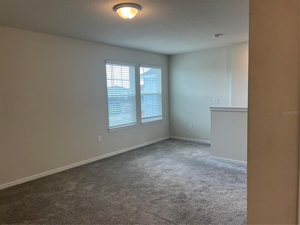 2007 Alluring Lane Davenport, FL 33896 - Photo 14 of 31 an empty room with windows