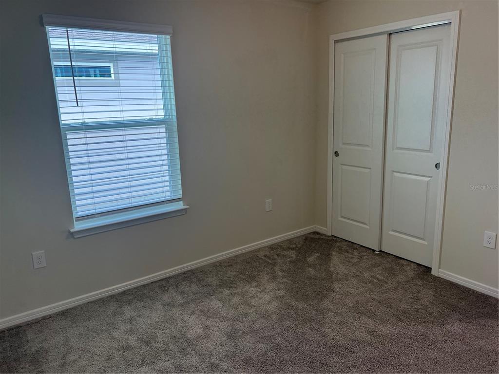 2007 Alluring Lane Davenport, FL 33896 - Photo 15 of 31 a view of an empty room with a window