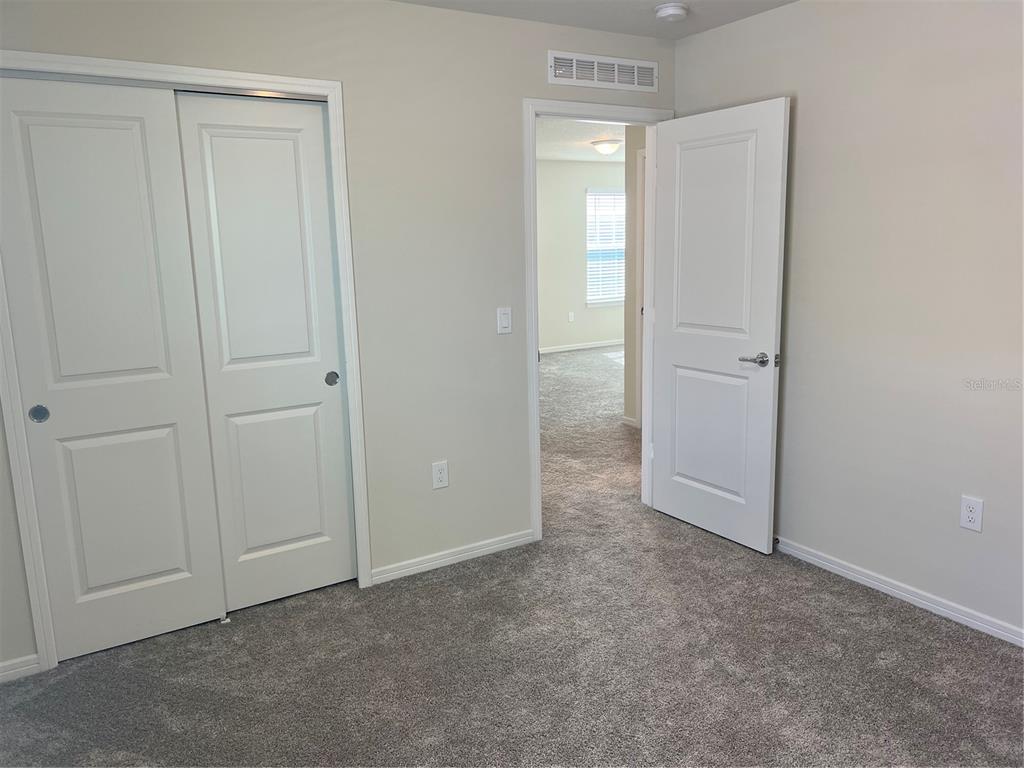 2007 Alluring Lane Davenport, FL 33896 - Photo 16 of 31 an empty room with closet area