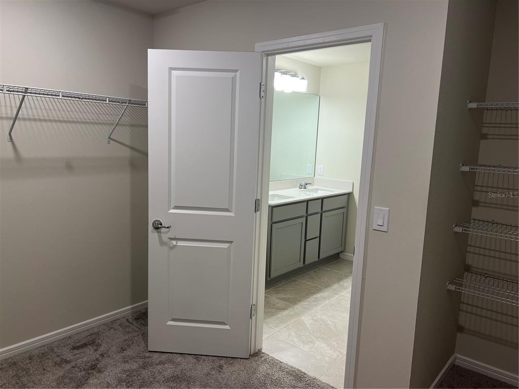 2007 Alluring Lane Davenport, FL 33896 - Photo 24 of 31 a view of cabinets and utility room with a sink