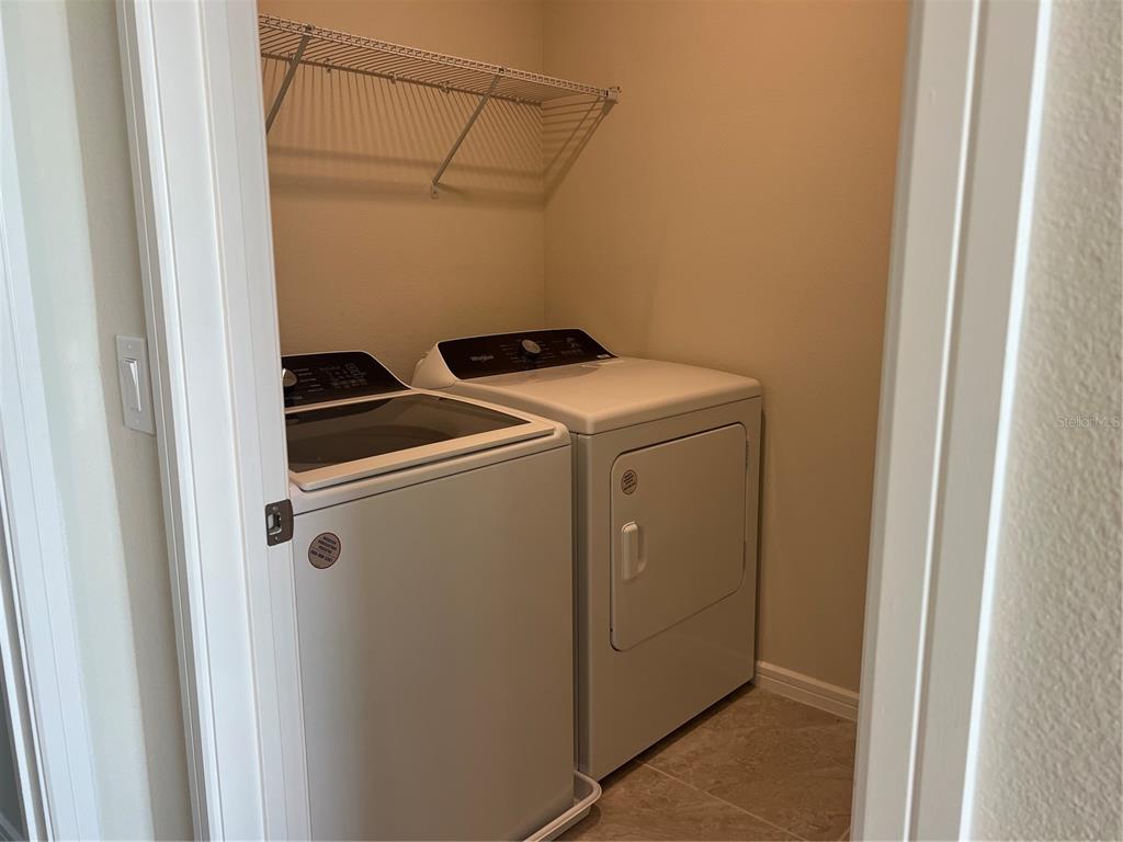 2007 Alluring Lane Davenport, FL 33896 - Photo 26 of 31 a utility room with dryer and washer