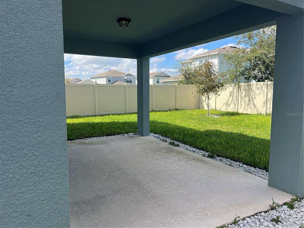 2007 Alluring Lane Davenport, FL 33896 - Photo 28 of 31 a view of a porch with a yard