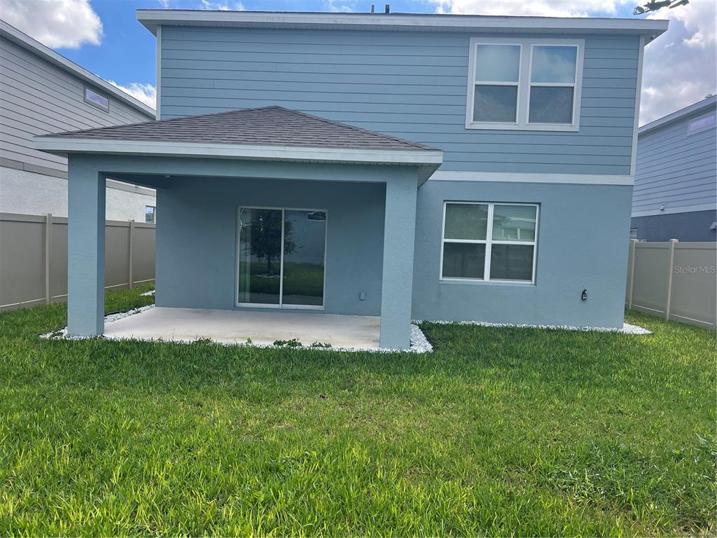 2007 Alluring Lane Davenport, FL 33896 - Photo 29 of 31 a view of a house with backyard
