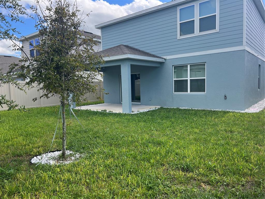 2007 Alluring Lane Davenport, FL 33896 - Photo 30 of 31 a house view with a garden space