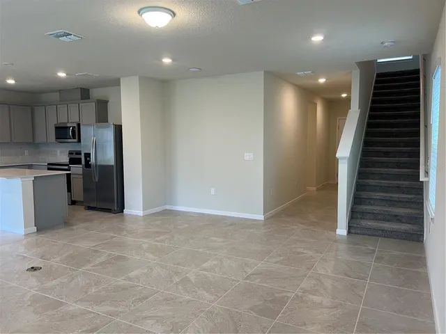 a view of kitchen with cabinets and stainless steel appliances