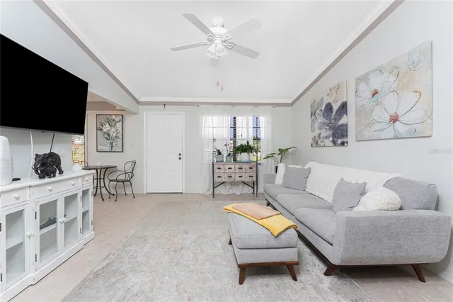 a view of a livingroom with furniture and bedroom