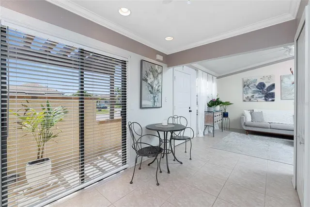 a bedroom with a bed and a ceiling fan