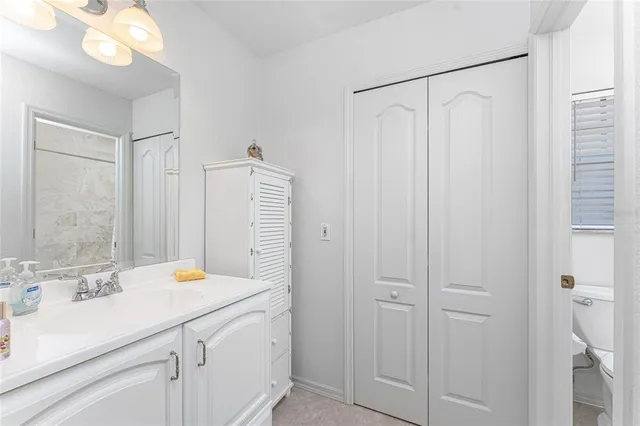 a bathroom with a toilet and a bathtub