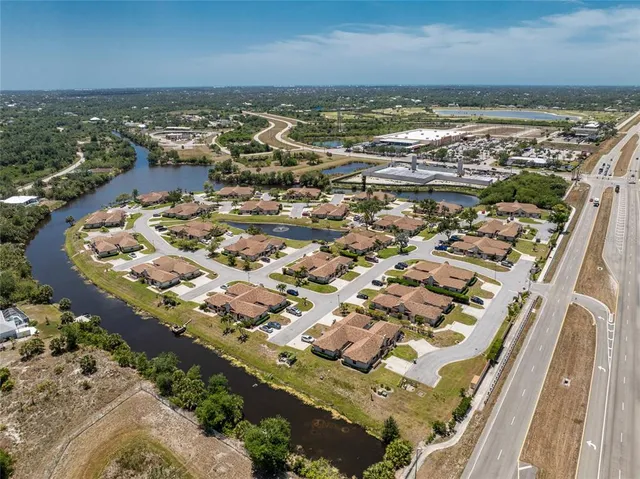 an aerial view of a house with a lake view