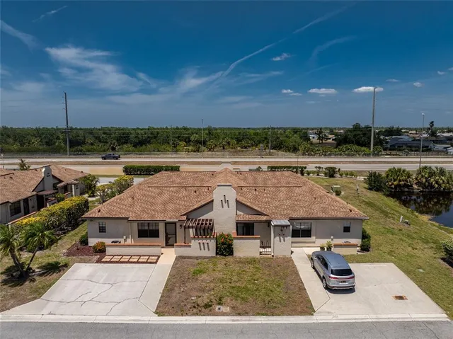 a view of a swimming pool with an outdoor seating