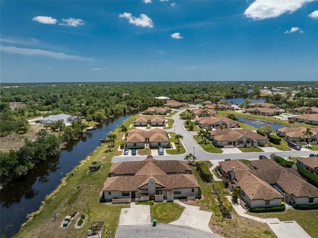 a front view of a house with a garden and yard