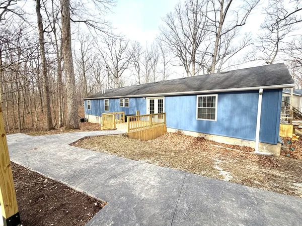 a view of a house with snow on the background