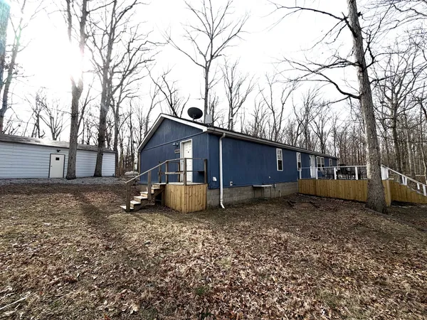 a house view with a backyard space