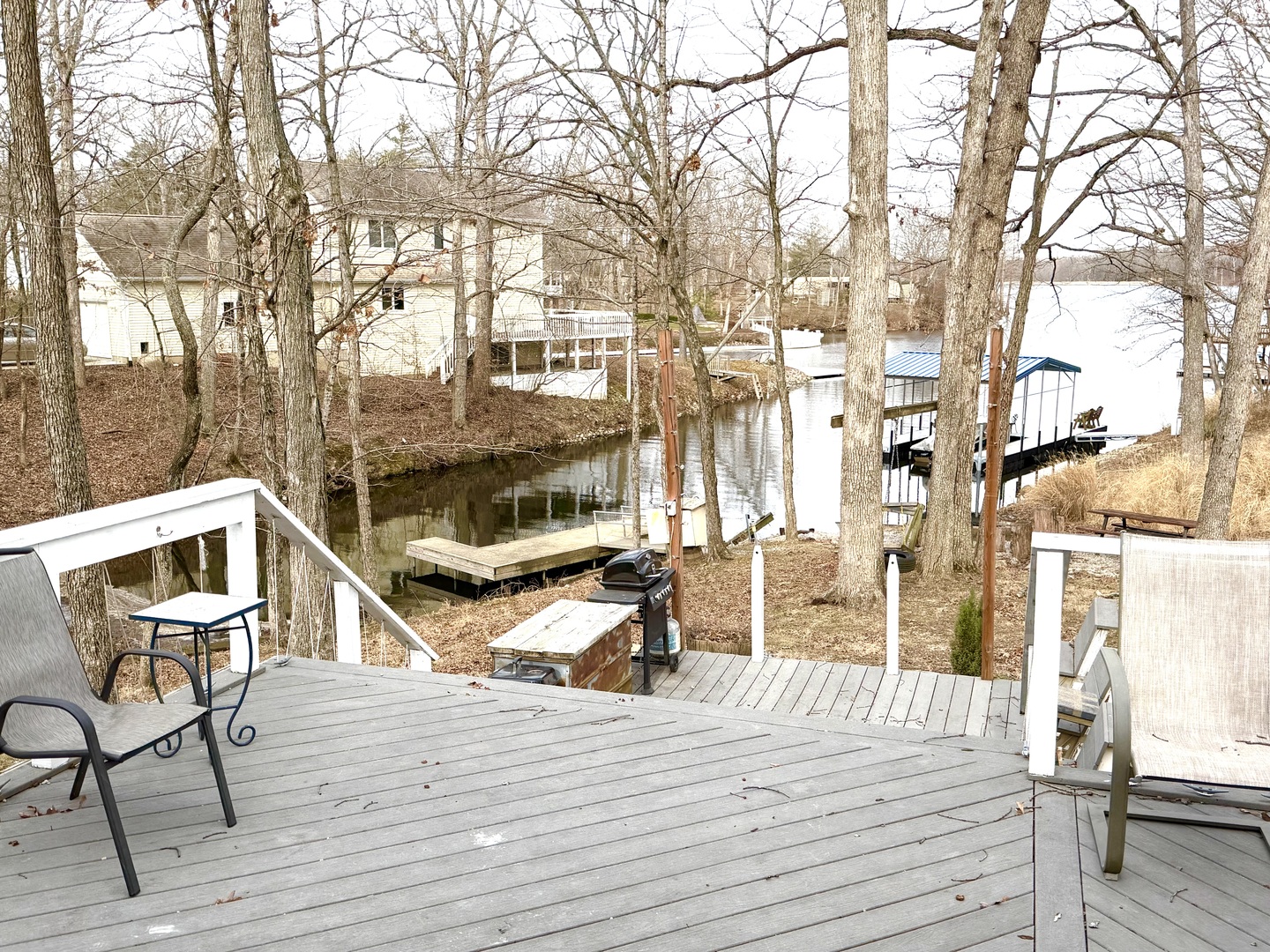 2235 Chesapeake Lane Centralia, IL 62801 - Photo 3 of 22 a view of a roof deck with table and chairs with wooden floor and fence