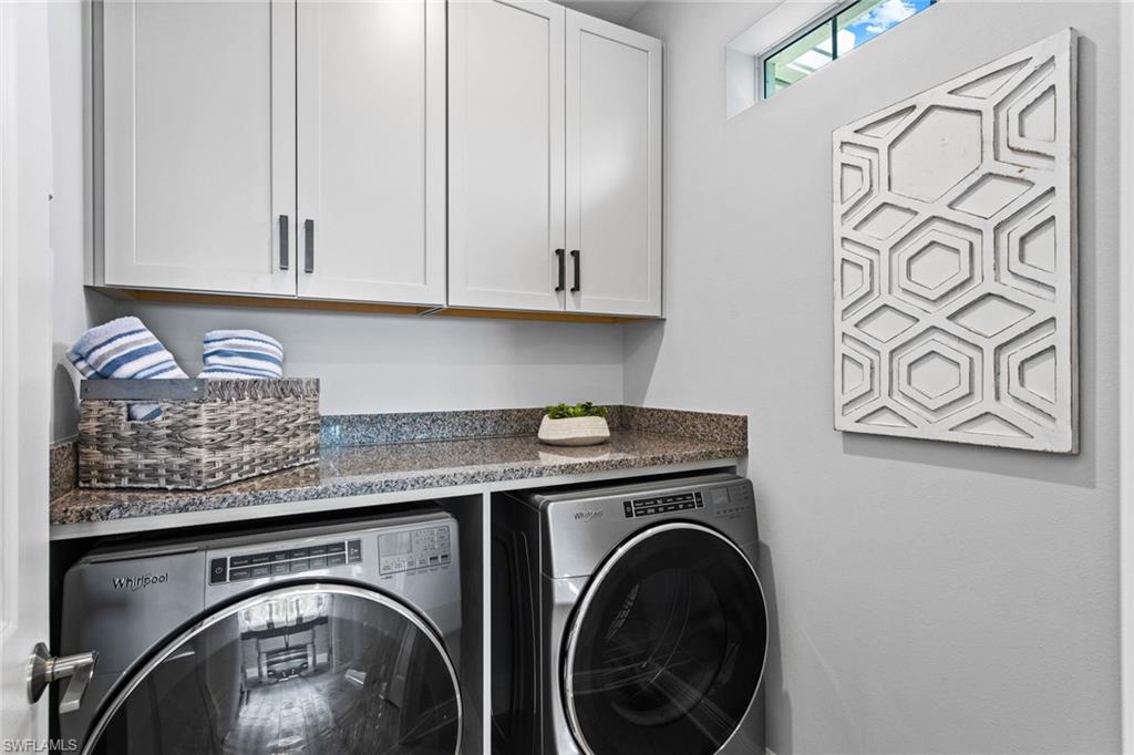 4551 Arboretum Circle, Unit 203 Naples, FL 34112 - Photo 11 of 22 a utility room with dryer and washer