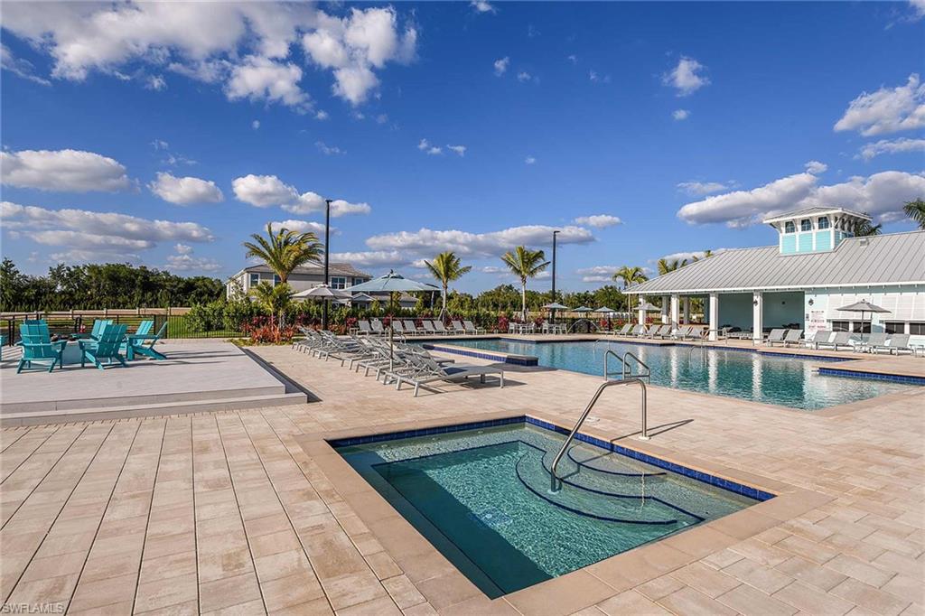 4551 Arboretum Circle, Unit 203 Naples, FL 34112 - Photo 20 of 22 a view of a swimming pool with a patio