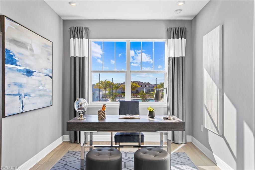 4551 Arboretum Circle, Unit 203 Naples, FL 34112 - Photo 10 of 22 a view of a dining room with a table and chairs