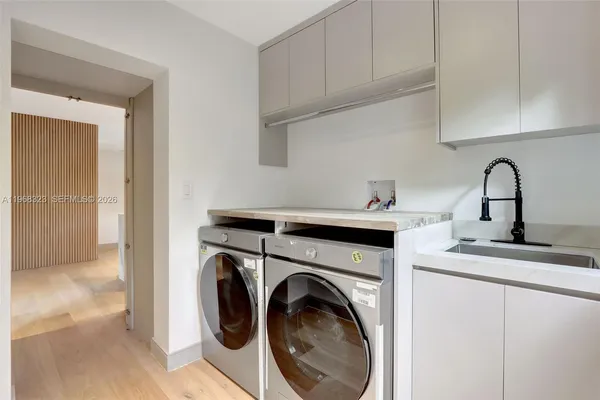 a view of living room with washer and dryer