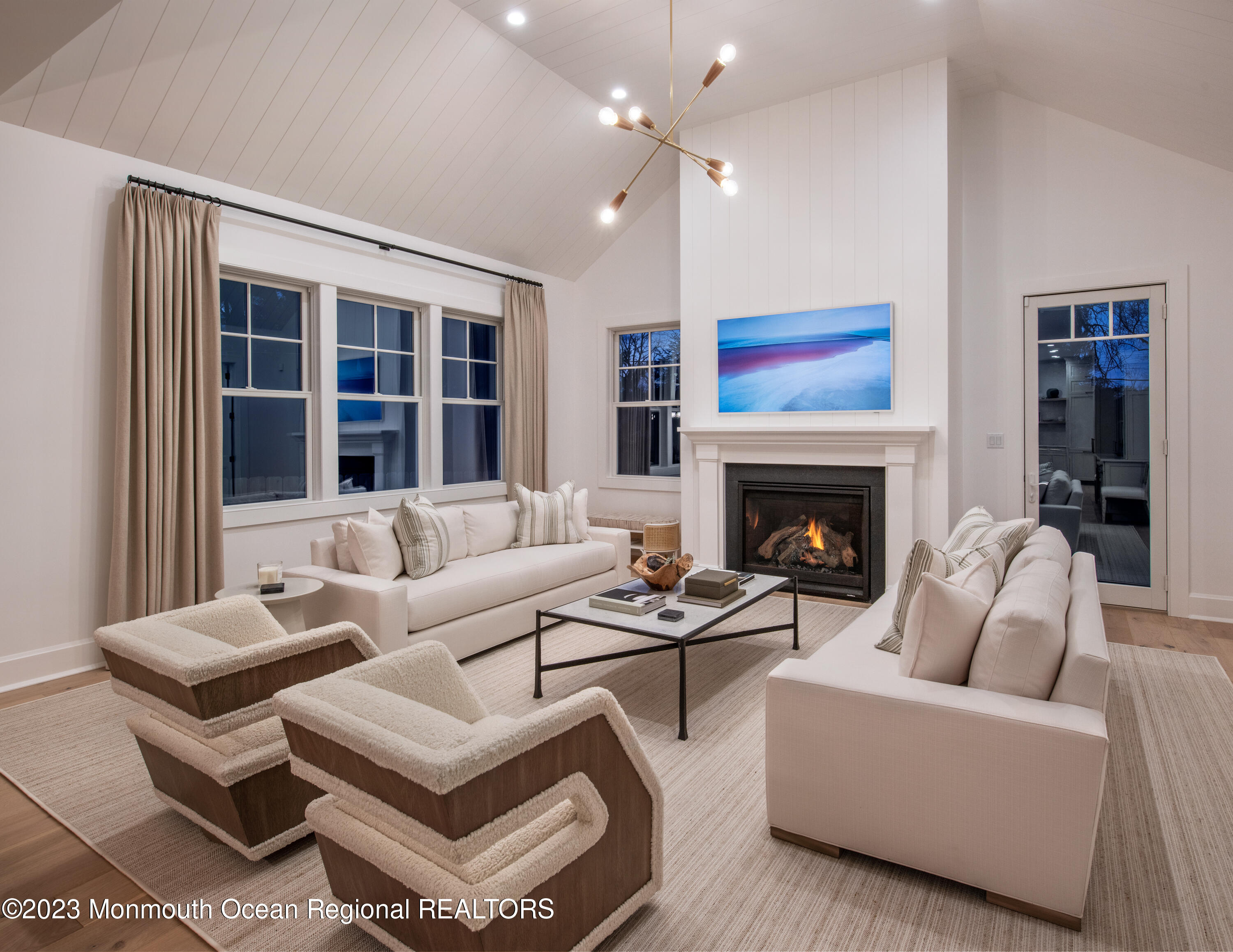 7 Bingham Avenue Rumson, NJ 07760 - Photo 6 of 14 a living room with furniture a fireplace and a flat screen tv