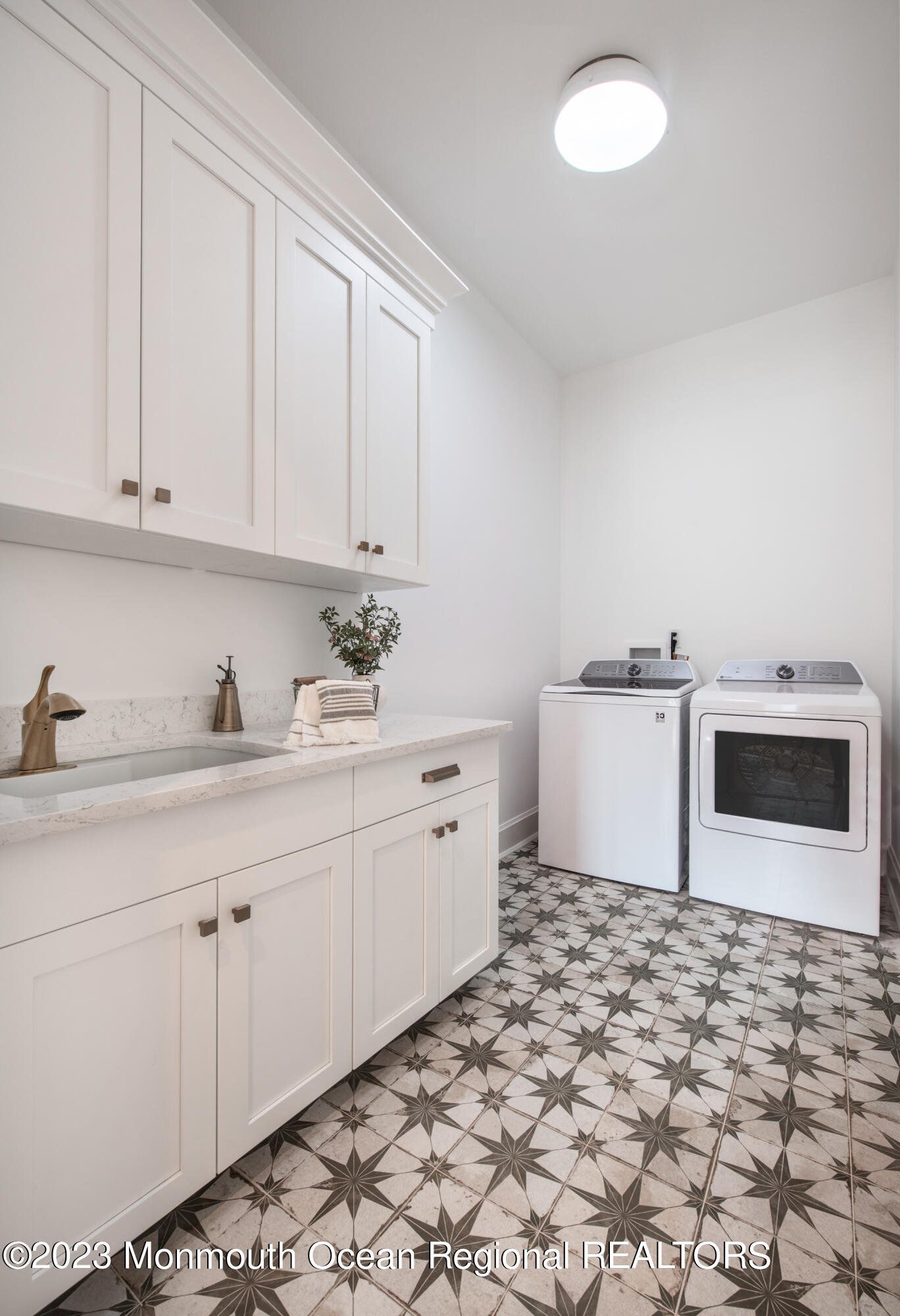 7 Bingham Avenue Rumson, NJ 07760 - Photo 7 of 14 a kitchen with granite countertop a sink a stove a microwave and cabinets