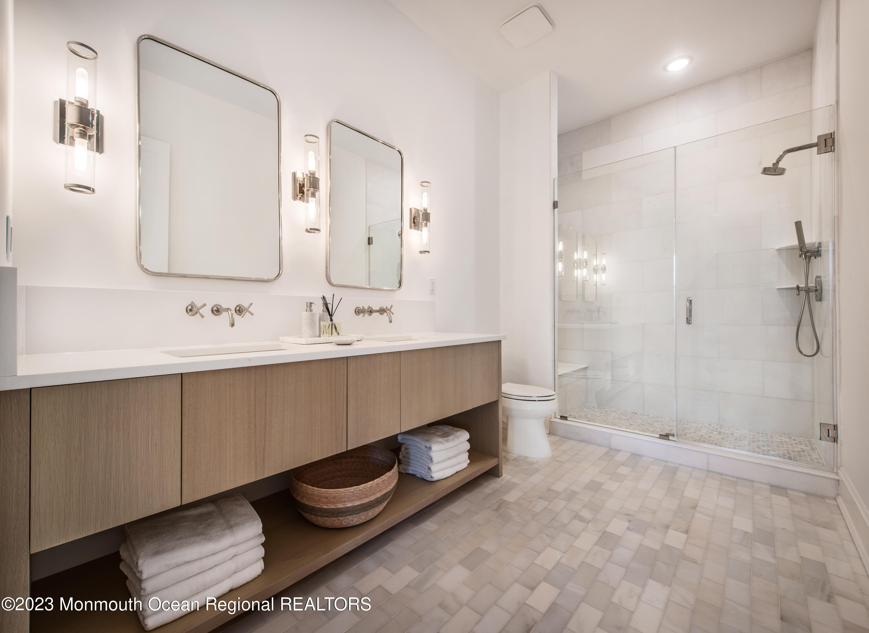 7 Bingham Avenue Rumson, NJ 07760 - Photo 10 of 14 a bathroom with a double vanity sink and a mirror