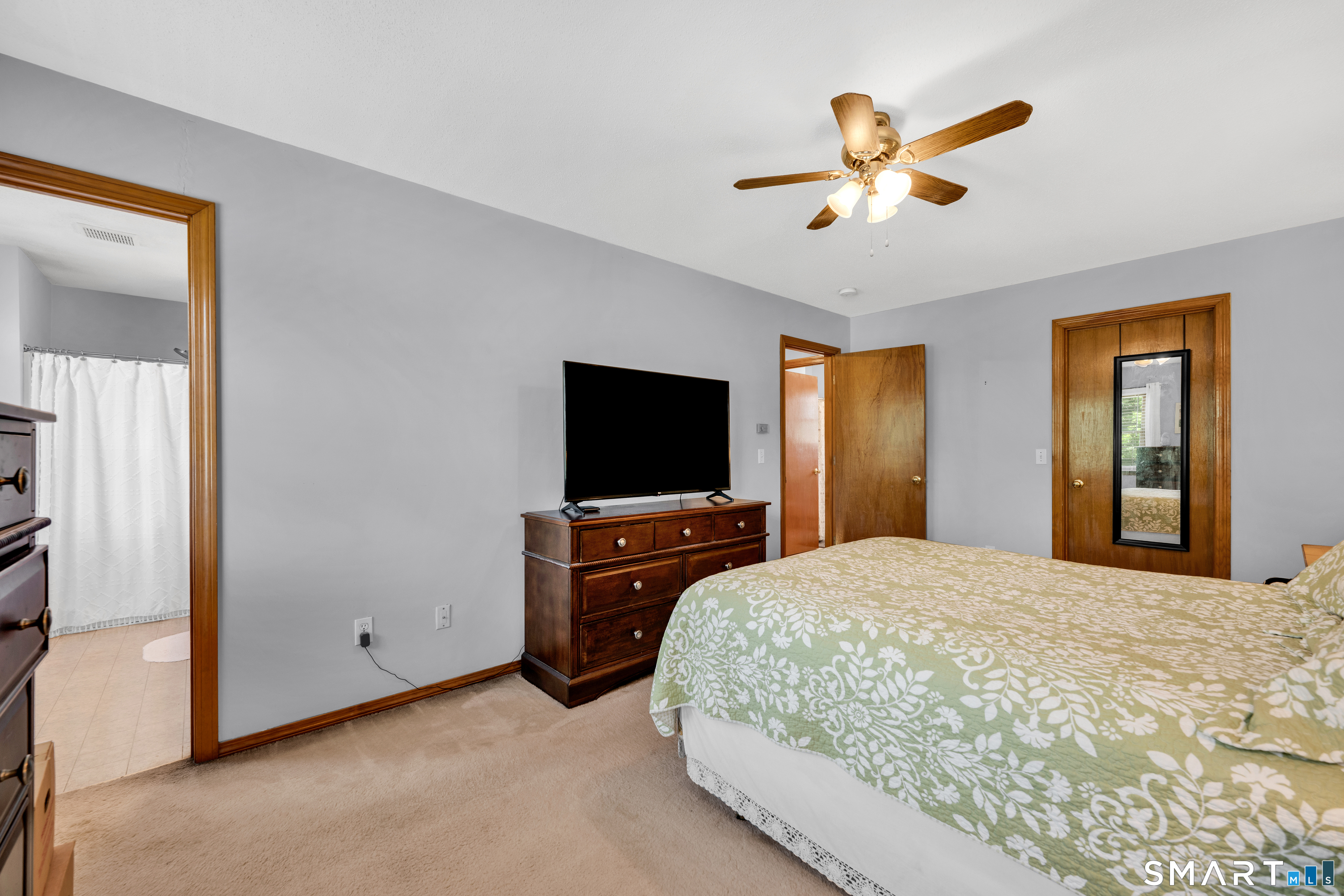 89 Windsorville Road South Windsor, CT 06074 - Photo 14 of 23 a bedroom with a bed and a flat screen tv