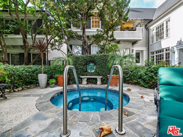 a backyard of a house with outdoor seating