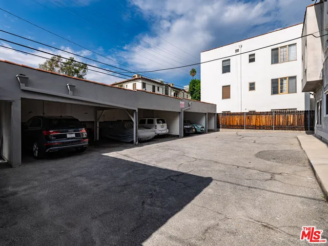 a view of a car park in front of house