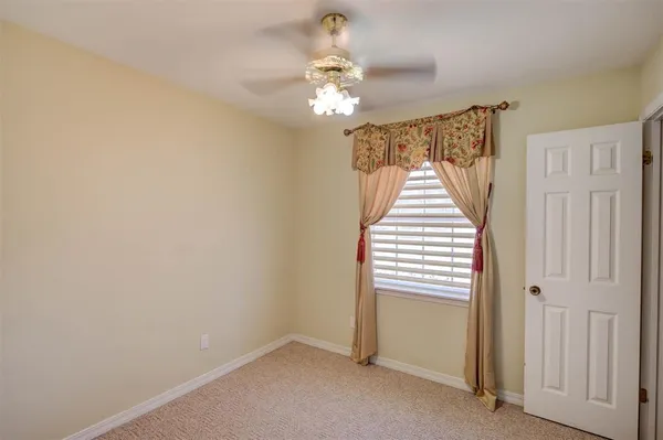 a very nice looking hallway with a chandelier