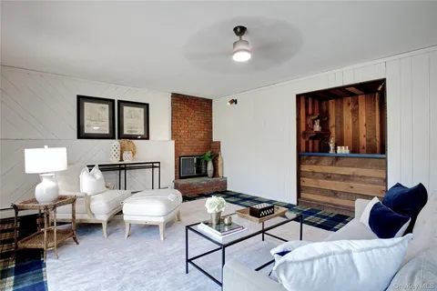 a bedroom with furniture and wooden floor