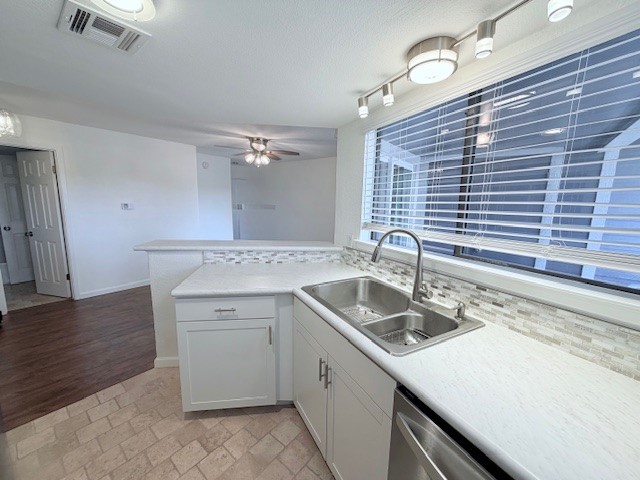 2500 Burleson Road, Unit 713 Austin, TX 78741 - Photo 4 of 15 A well-lit kitchen with sleek countertops and modern stainless steel appliances.