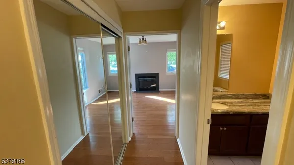 a bathroom with a glass door shower and a sink
