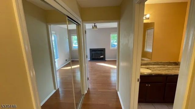 a bathroom with a glass door shower and a sink