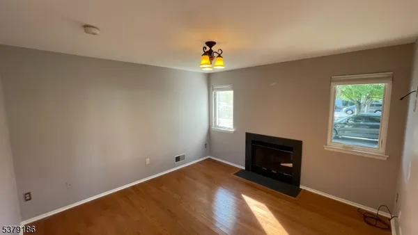 a bedroom with a bed and a fireplace