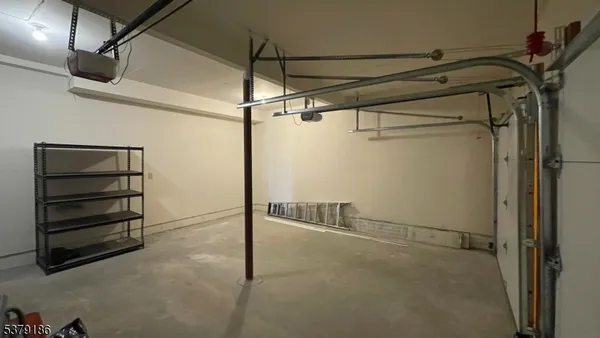 a view of a swimming pool with a lounge chair