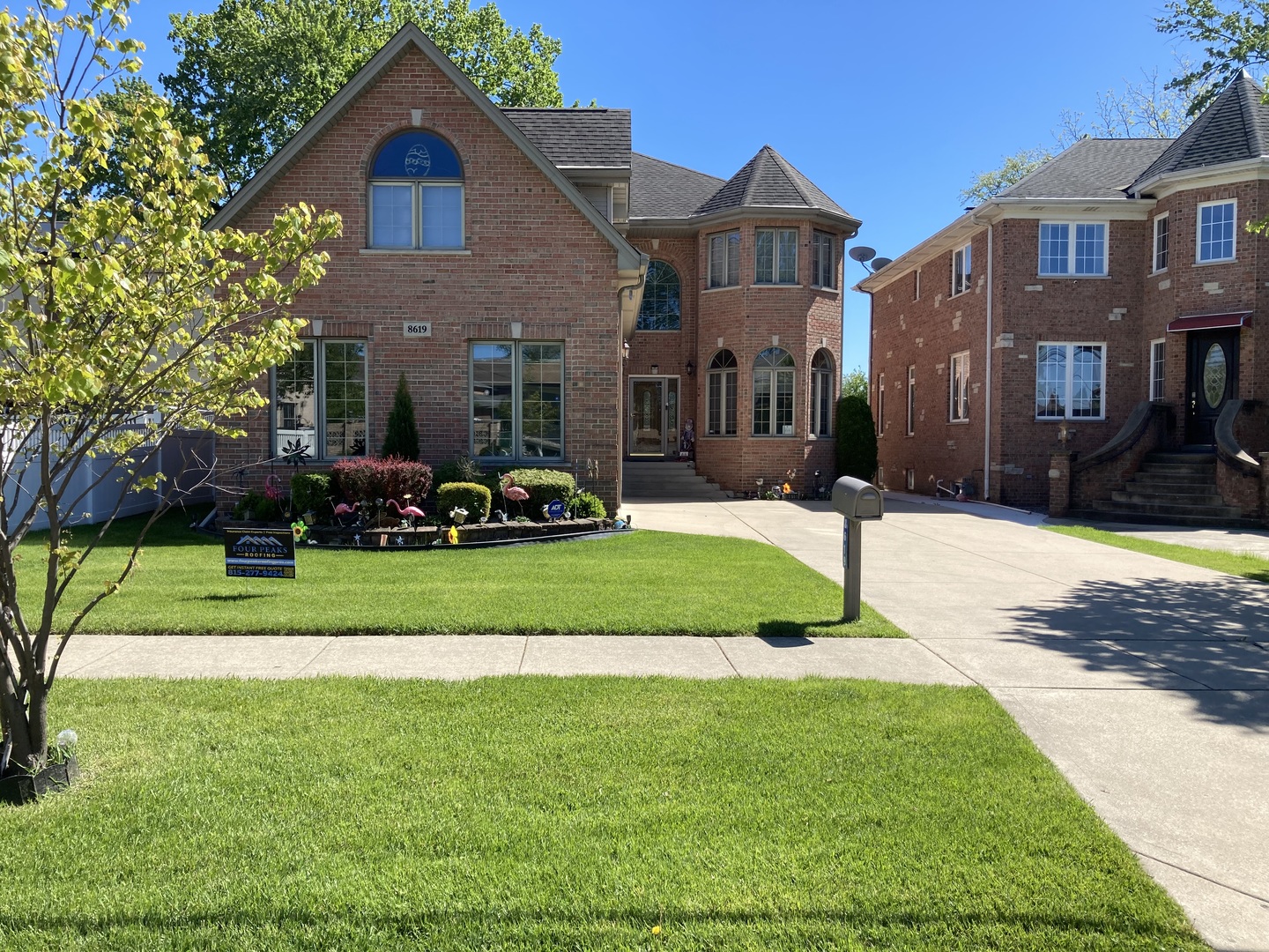 8619 West Sunset Road Niles, IL 60714 - Photo 2 of 37 a front view of a house with a yard