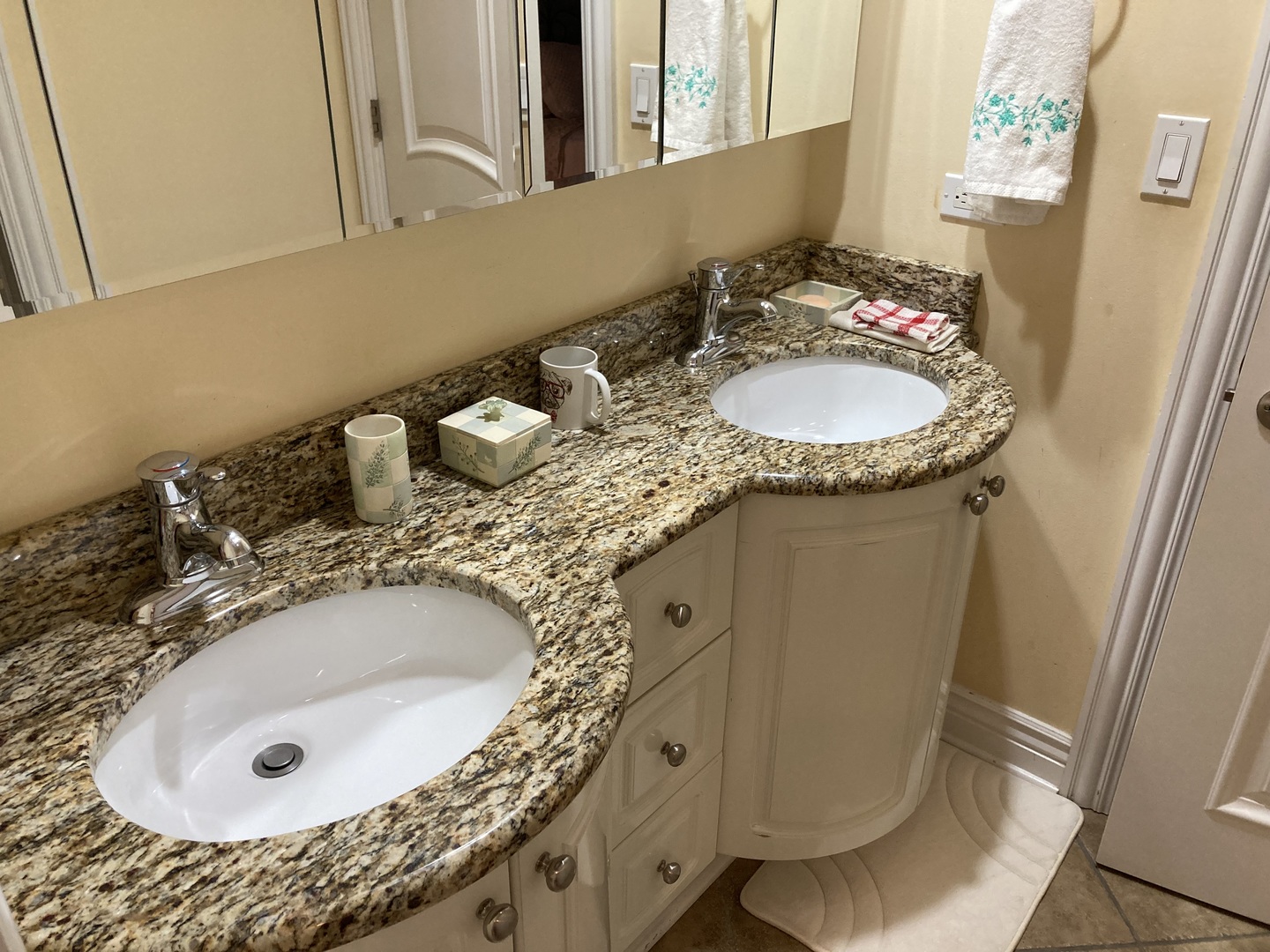 8619 West Sunset Road Niles, IL 60714 - Photo 23 of 37 a bathroom with a granite countertop sink a toilet and mirror