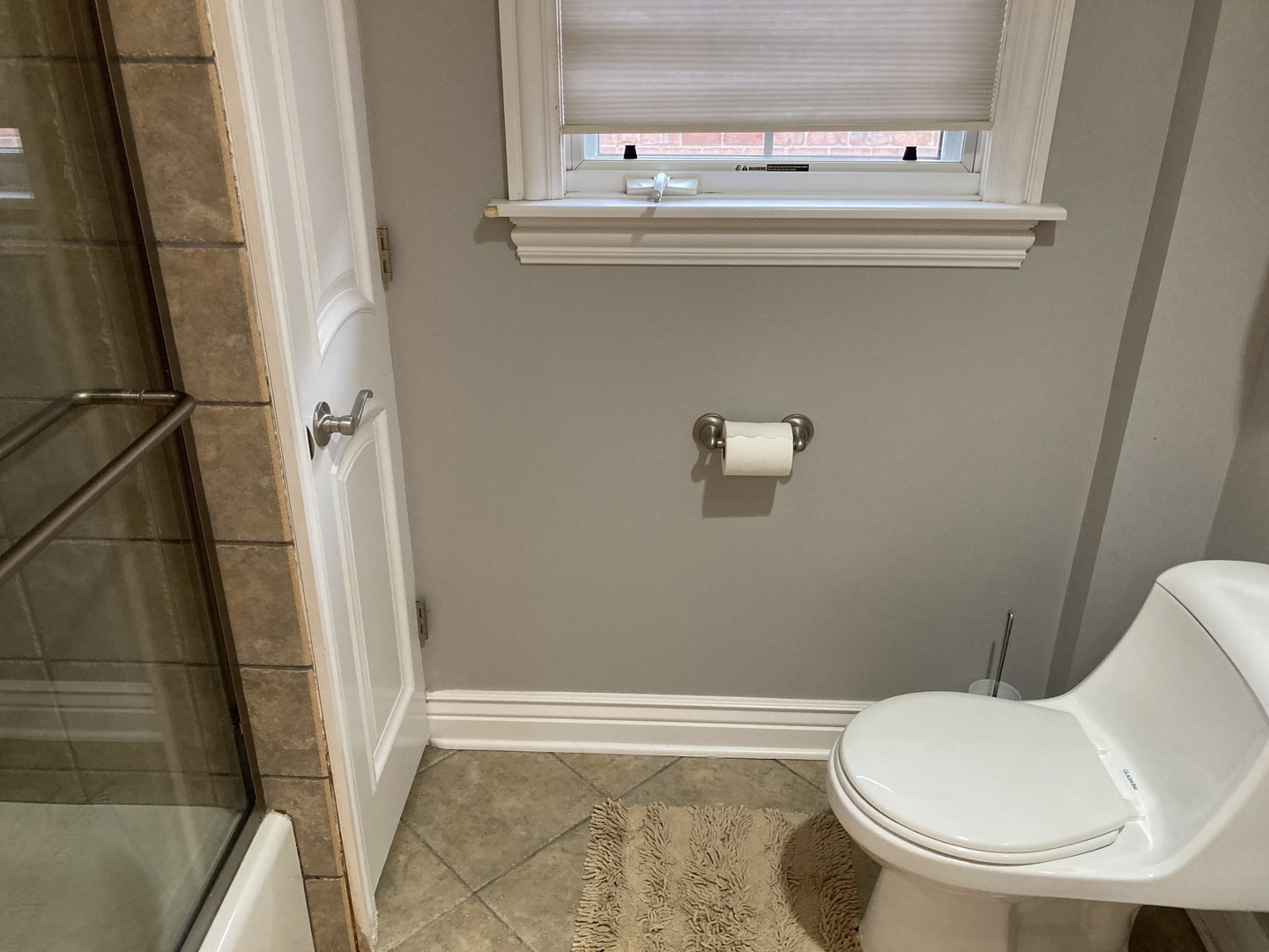 8619 West Sunset Road Niles, IL 60714 - Photo 24 of 37 a bathroom with a toilet and a sink