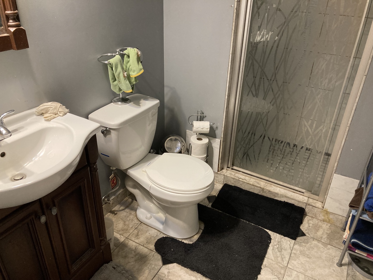 8619 West Sunset Road Niles, IL 60714 - Photo 30 of 37 a white toilet sitting next to a bathroom sink