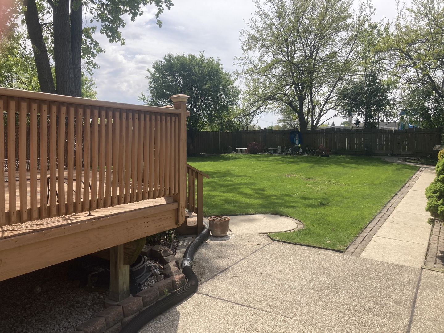 8619 West Sunset Road Niles, IL 60714 - Photo 31 of 37 a view of a backyard with wooden fence