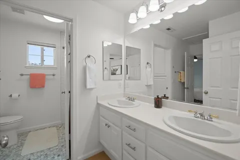 a bathroom with a bathtub and shower