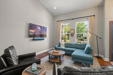 a living room with furniture and a large window