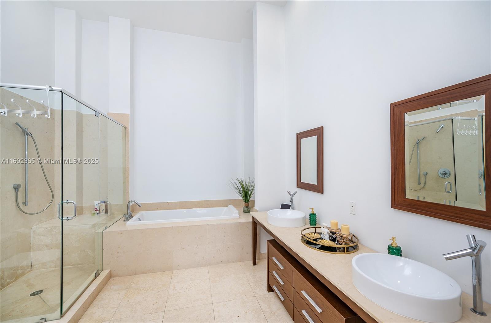495 Brickell Avenue, Unit 4103 Miami, FL 33131 - Photo 11 of 27 a bathroom with a granite countertop sink mirror toilet and bathtub