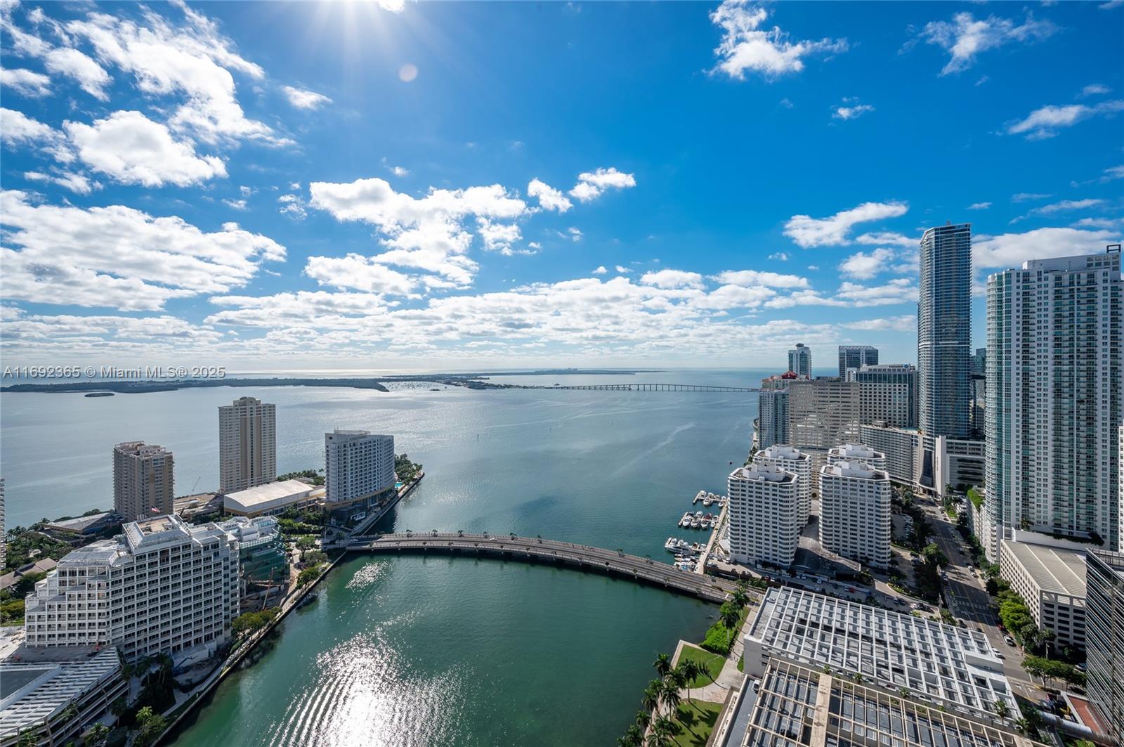 495 Brickell Avenue, Unit 4103 Miami, FL 33131 - Photo 19 of 27 a view of a balcony with dining table and chairs